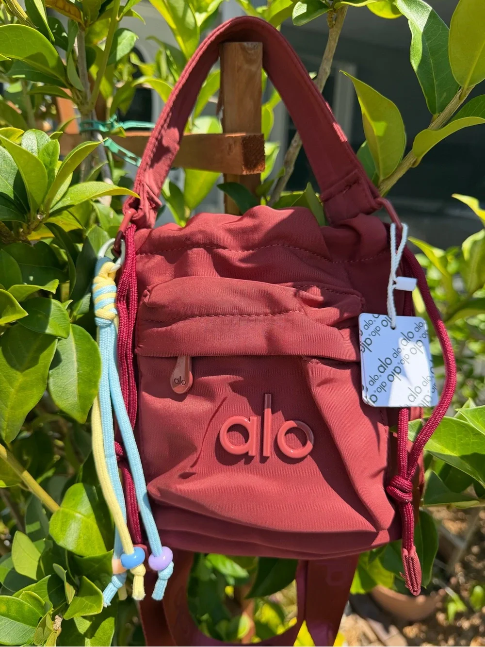 ALO Yoga Burgundy  Drawstring Mini Bucket Bag with Multicolor Cord Tassels